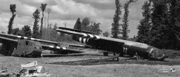 British and American Gliders lay side by side in
French pastures where they landed Airborne infantry on D-Day